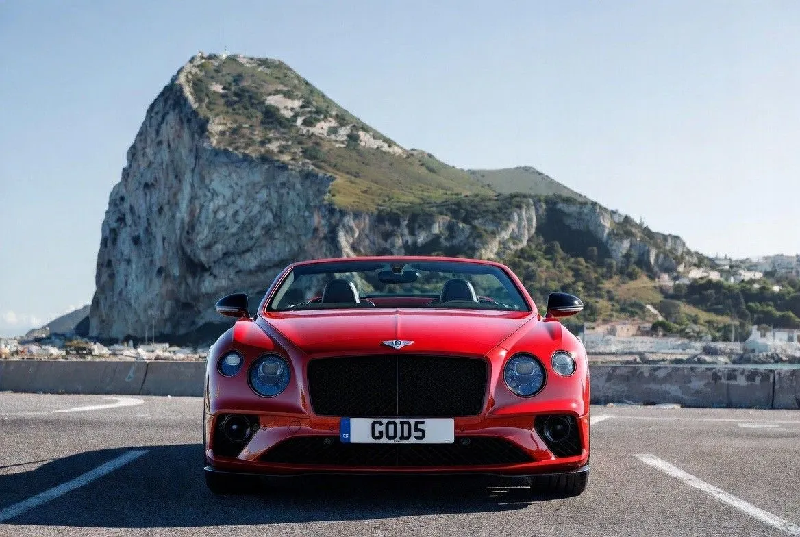 Red Bentley with GOD5 registration by the Rock of Gibraltar